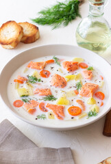 Finnish fish soup lohikeitto with salmon and vegetables. National cuisine. Healthy eating.