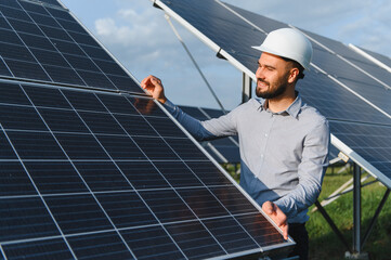 Engineer inspecting solar panel for renewable energy future