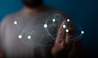 Abstract image of a hand interacting with a digital network.  Ideal for technology, connection, and global concepts.