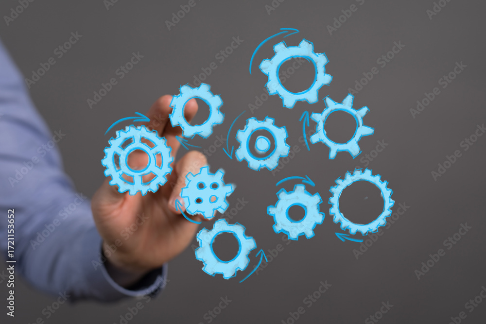 Poster abstract image of gears and a hand, symbolizing teamwork, collaboration, and process optimization.