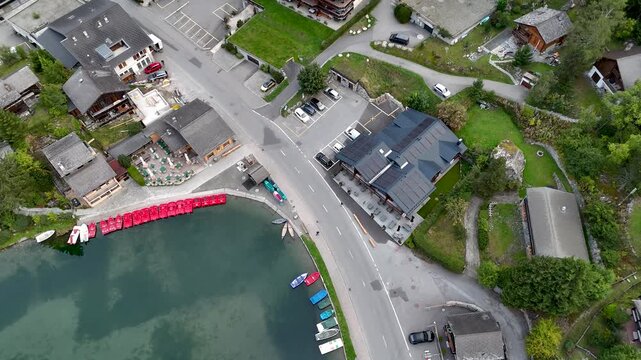 4K High resolution aerial drone video of the beautiful town of Champex Lac Switzerland one of the gems that the TMB- Tour du Mont Blanc goes through with small houses and a beautiful lake