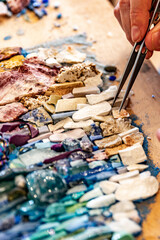 Mosaic artisan at work – creation of glass and stone mosaics