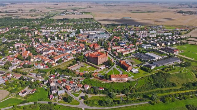 Aerial view of Gniew with medieval castle symbolizing resilience and community