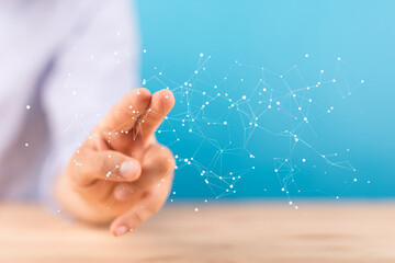 Hand interacts with a digital network.  Innovation, technology, connection.
