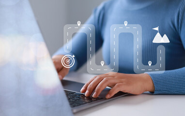 Businesswoman touching virtual screen on computer screen. Project planning or strategy process....