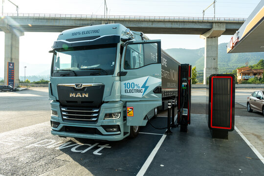 Commercial electric truck charges at station symbolizing zero emission logistics sustainable freight solutions and clean e mobility growth. Spain, Europe &ndash; August 8, 2025
