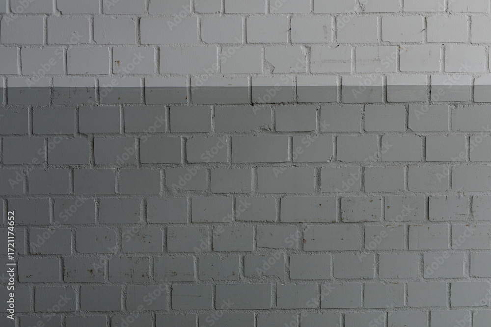 Poster high-resolution image of a brick wall with a two-tone gray and white color scheme. ideal for backgro