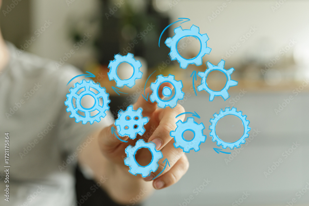 Poster abstract image of hand interacting with gears, symbolizing teamwork, collaboration, and process opti