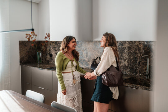 Couple celebrating new real estate purchase in modern kitchen