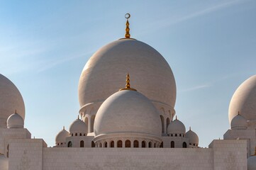 Majestic domes of Sheikh Zayed Grand Mosque in Abu Dhabi, Islamic architecture © Davenat.art