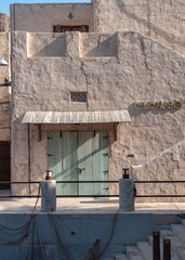 Obraz premium Rustic Architecture with Vintage Door in Dubai