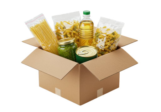 Open brown cardboard box filled with spaghetti, pesto, canned goods, cooking oil, and various dry pasta, neatly arranged on a transparent background with copy space, concept of food aid and charity