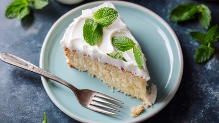 lice of Cake with White Icing and Mint: Decadent Slice of Cake with Smooth White Icing & Fresh Mint, Sweet Vanilla Slice of Cake Topped with White Icing and Mint Leaves