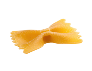 Close-up of a single farfalle pasta, light yellow/tan color,  with a  twisted, bow-tie shape