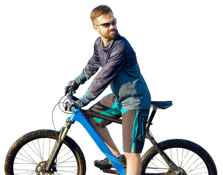 Cyclist in shorts and jersey on a modern carbon hardtail bike with an air suspension fork standing on a cliff against the background of fresh green spring forest