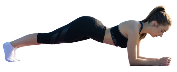 Plakat A young slim athletic girl in sportswear performs a set of exercises.
