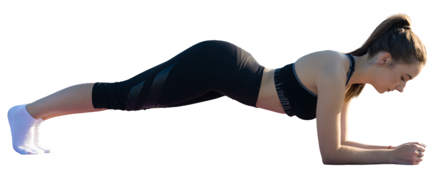 A young slim athletic girl in sportswear performs a set of exercises.