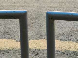 Gray Fence by Water  Puddle. Wet and Dry Contrast.
