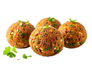 Three golden, round, spiced balls, topped with fresh herbs, rest on a surface