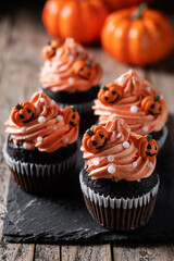 Halloween cupcakes with Halloween sprinkles on wooden table