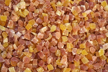 Full frame of dried sweetened diced papaya.