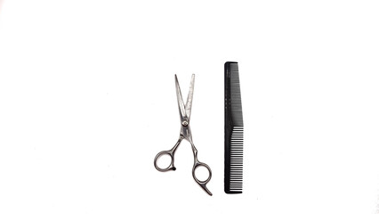 Professional Haircut Barber Scissor and black comb isolated on White Background