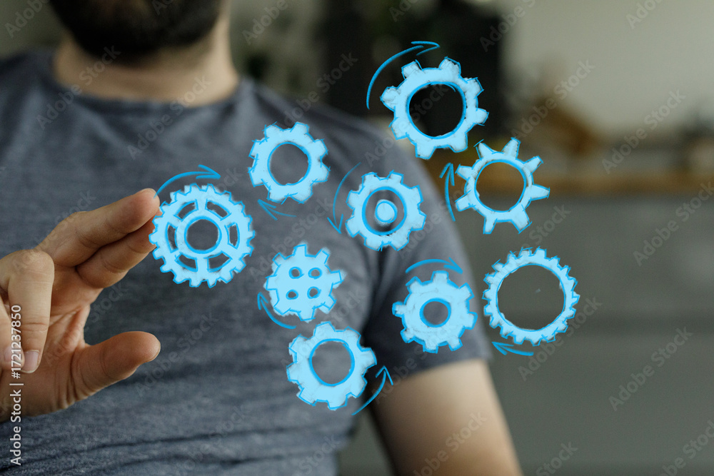 Poster conceptual image of a man interacting with digital gears, symbolizing teamwork, collaboration, and w
