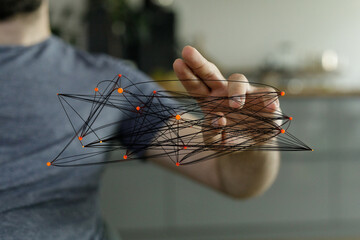 Abstract image of a hand interacting with a complex network, representing connection, technology,...