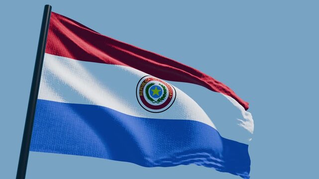 パラグアイ.の国旗が青空の下で風に靡く（4K）