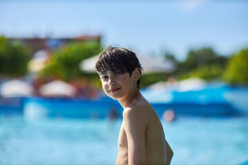 Boy enjoys summer day at the water park © justoomm