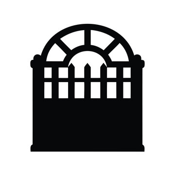 A black silhouette of an arched window with a picket fence design