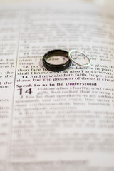 Wedding rings on the open Bible