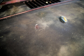 Close up of peeled and faded paintwork car bonnet