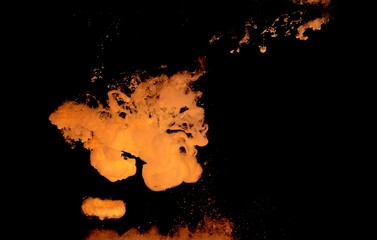 Orange colorful fluorescent smoke on black background,Art abstract smoke texture,Colored liquid dye,Splash paint,Abstract color,Abstract Textures	
