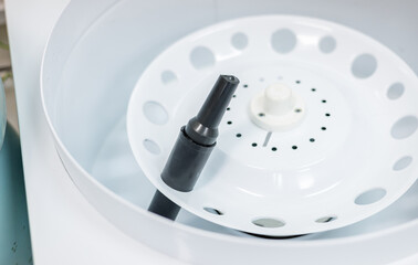 Tube inserted in a laboratory centrifuge. Centrifuge rotor for medical and scientific research.