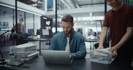 Business-Themed Compilation with Tired Manager Working Under Pressure Behind His Desk. The footage captures stress, fatigue, and frustration while trying to complete demanding projects on laptops - Powered by Adobe