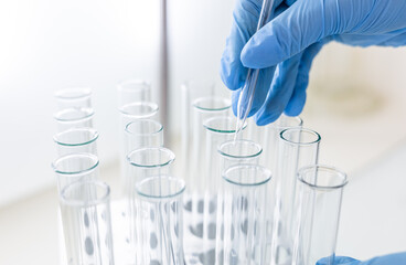 Concept of science and research with laboratory accessories. Laboratory flasks and test tubes on...