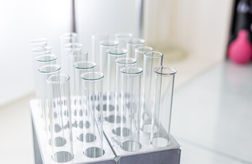 Concept of science and research with laboratory accessories. Laboratory flasks and test tubes on the table. Medical science laboratory glassware.