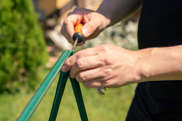 Assembling a garden garter for plants. Support and garter for plants. Accessories and tools for gardening