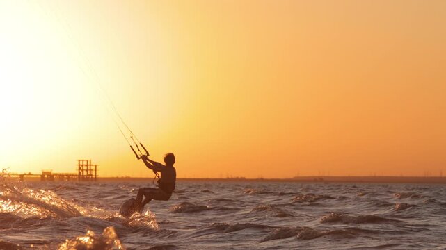 Cinematic slow motion kitesurfing at sunset