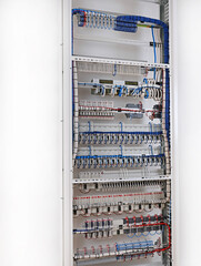 Installation of an electrical panel using nylon cable ties.