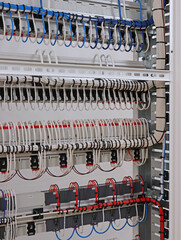 Installation of an electrical panel using nylon cable ties.
