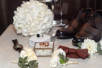 Stylish men's accessories on a white background. Wedding accessories.