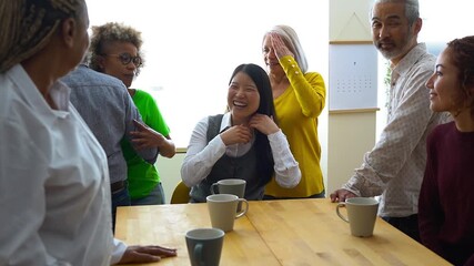Group of happy multiracial people having fun together drinking coffee indoor - Multi generational friends, lifestyle and diversity concept 