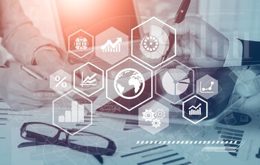 Business meeting with documents and graphs on desk