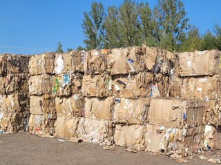 Compression cardboard and paper in a waste paper recycling plant, zero waste concept