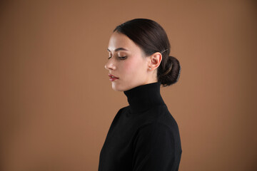 Portrait of beautiful woman on brown background