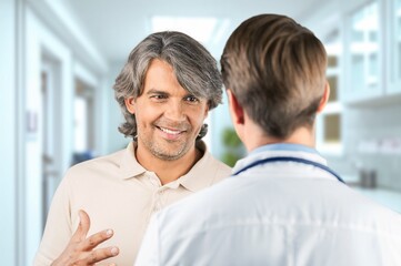 Clinic patient and doctor in modern hospital office