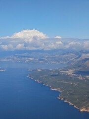 Fototapeta premium Coastline view of a vibrant landscape along the Adriatic Sea during a clear sunny day from an aerial perspective