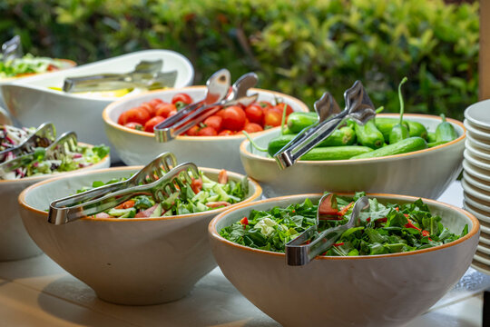 Mediterranean cuisine, olive oil, healthy and delicious  salad varieties with green vegetables.Vegetarian and vegan healty food, open buffet in a luxury hotel. Meze varieties, salad bar.